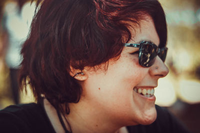 Close-up portrait of young woman looking away