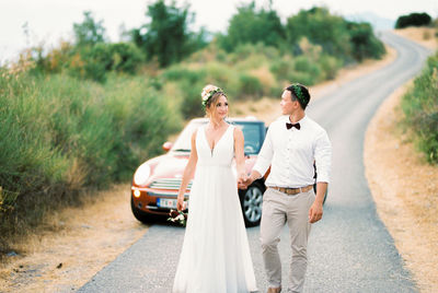 Couple standing on road