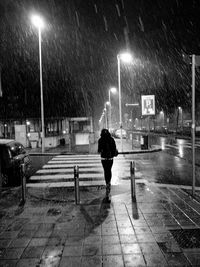 Blurred motion of woman walking on street