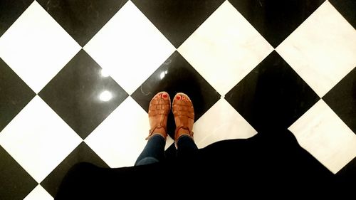 Low section of woman standing on floor