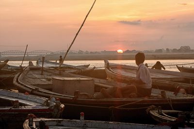 Rear view of man fishing on beach