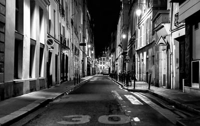 Illuminated city street at night