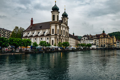 Jesuit church by reuss river in city during rainy season