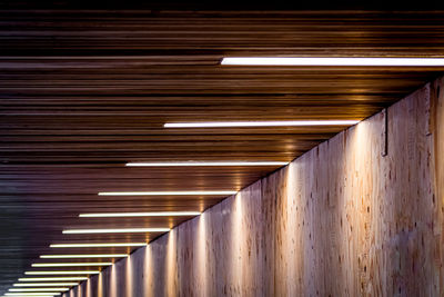 Low angle view of illuminated tunnel