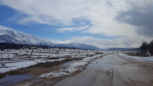 Scenic view of snowcapped mountains against sky