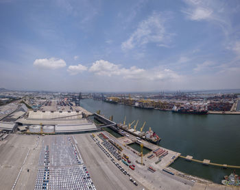 High angle view of river by city against sky