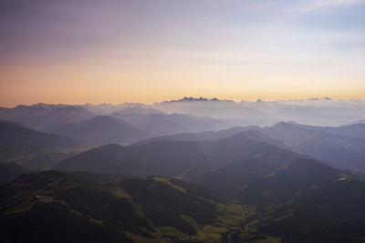 Scenic view of mountains against sky during sunset