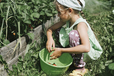 Midsection of woman with plants