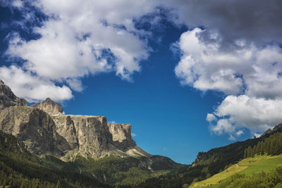 Scenic view of rocky mountains against sky at alto adige