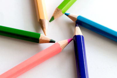 High angle view of colored pencils on table