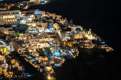 High angle view of illuminated buildings in city at night