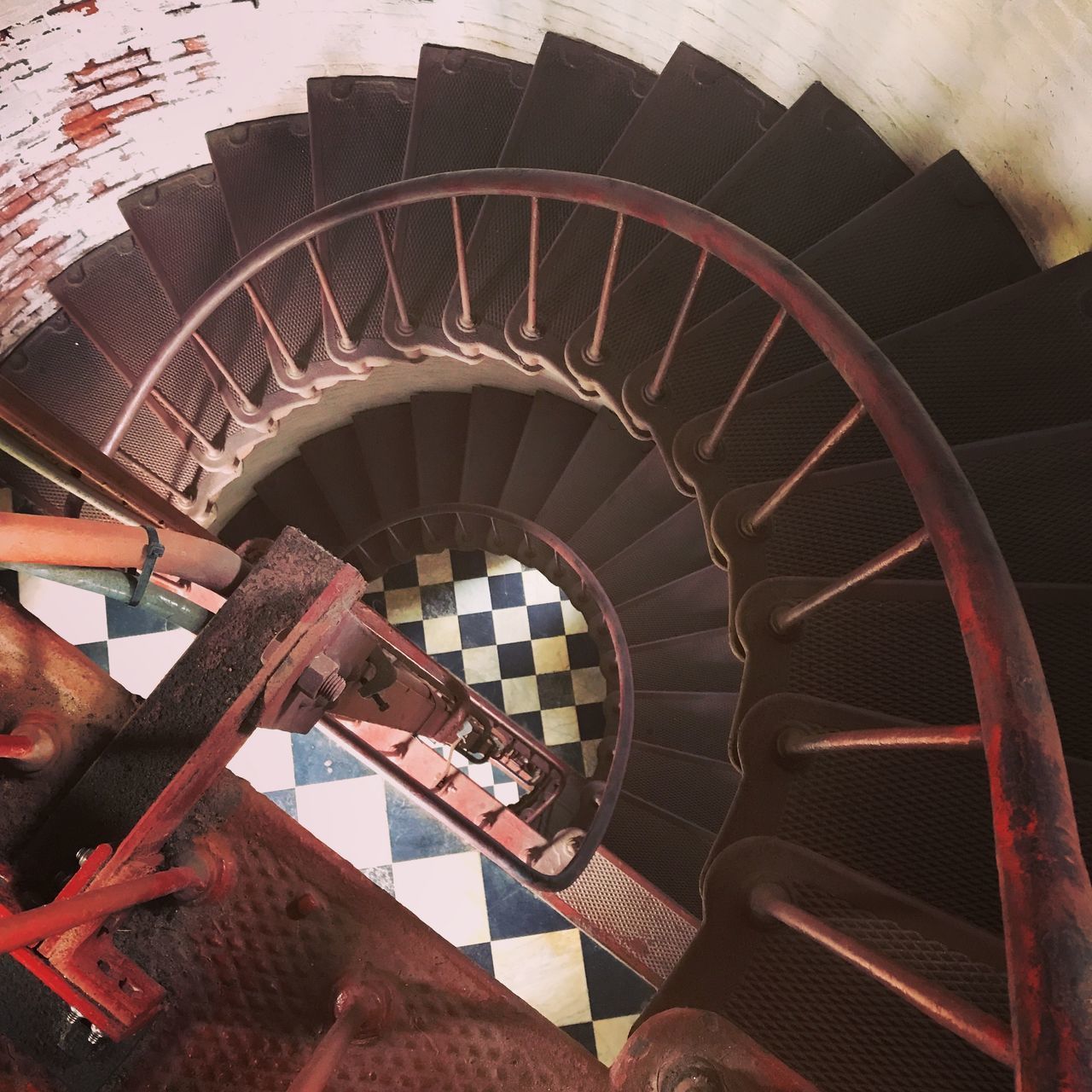 HIGH ANGLE VIEW OF SPIRAL STAIRCASE IN OLD WAREHOUSE