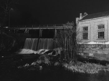 Water splashing on built structure at night