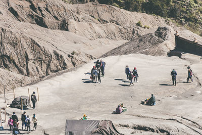 High angle view of hikers on volcanic land