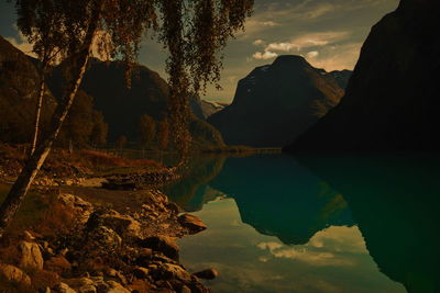 Scenic view of lake against sky during sunset