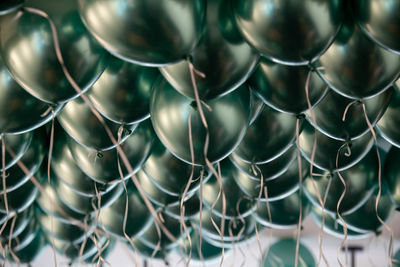 A large group of baloons floating, birthday celebration