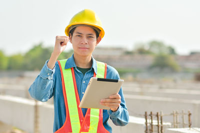 Portrait of mature man using mobile phone