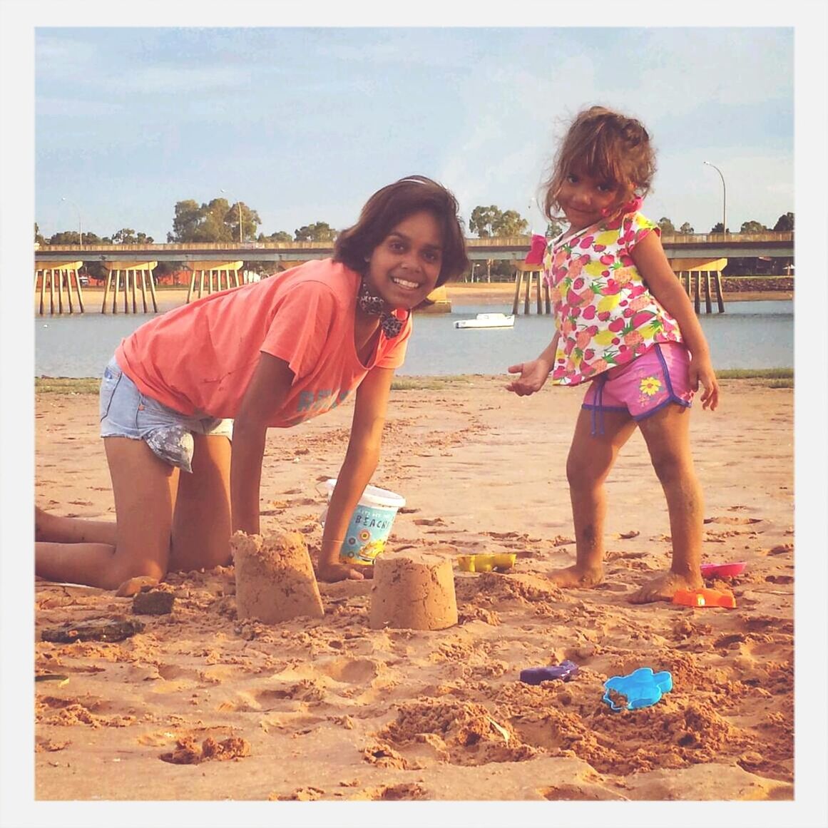 childhood, lifestyles, leisure activity, full length, girls, transfer print, beach, elementary age, casual clothing, togetherness, person, sand, enjoyment, boys, auto post production filter, fun, bonding, love