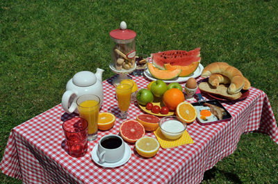 Breakfast or brunch with fresh coffee, ham and egg, domestic croissants, cookies, orange juice