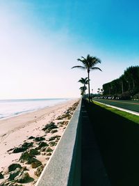 Scenic view of beach against clear blue sky
