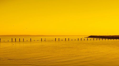 View of calm sea at sunset