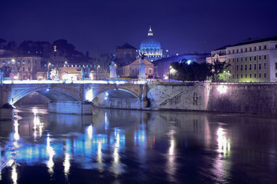 Reflection of illuminated buildings in water