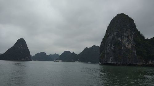 Panoramic view of sea and mountains against sky