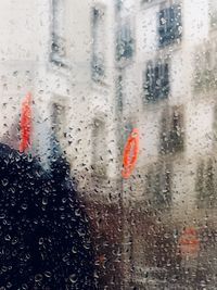 Raindrops on glass window in rainy season