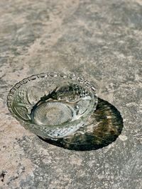 High angle view of coins on floor