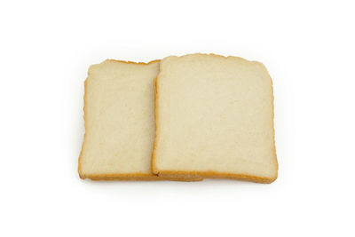 Close-up of bread against white background