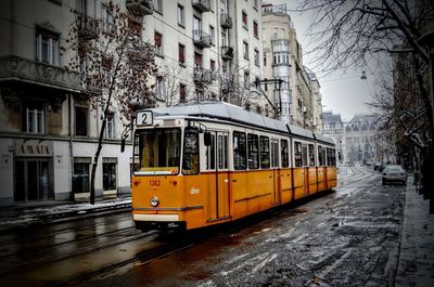 Cars on street in city during winter