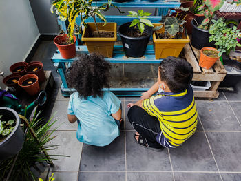 Two kids looking at the small garden. taken on 1st july 2021.