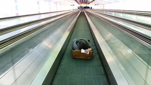 High angle view of man on escalator