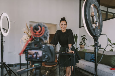 Businesswoman vlogging at office