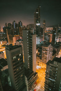 High angle view of illuminated buildings in city at night