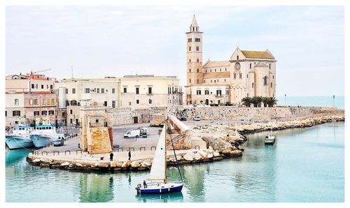 Boats moored at harbor