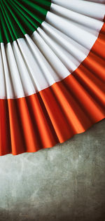 Close-up of paper hand fan on table