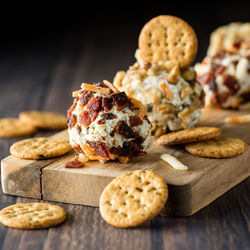 A dill pickle cream cheese fat bomb served with crispy crackers.