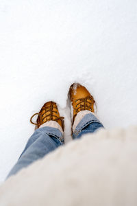 Boots in the snow, top view.