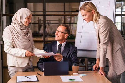 Business colleagues working at office