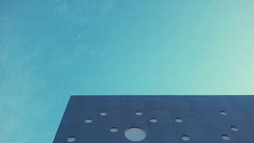 Low angle view of building against blue sky