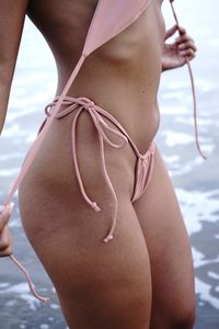 Midsection of woman in bikini