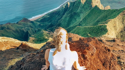 Rear view of woman looking at view of mountain