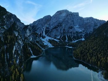 Scenic view of lake and mountains against sky