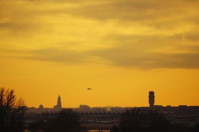 Silhouette of city at sunset