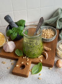Fresh made pesto sauce. green basil pesto. ingredient for pesto sauce 