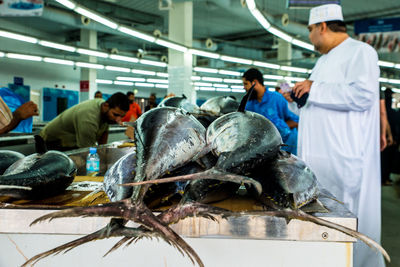 Group of people in fish for sale