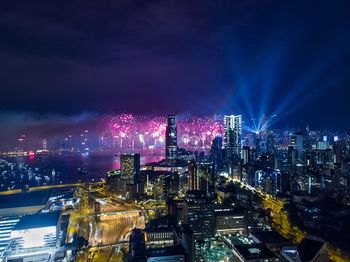 High angle view of illuminated city buildings at night