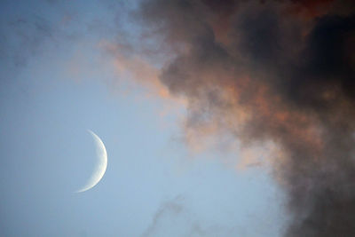 Low angle view of moon against sky at night