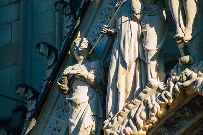 Low angle view of statues against building